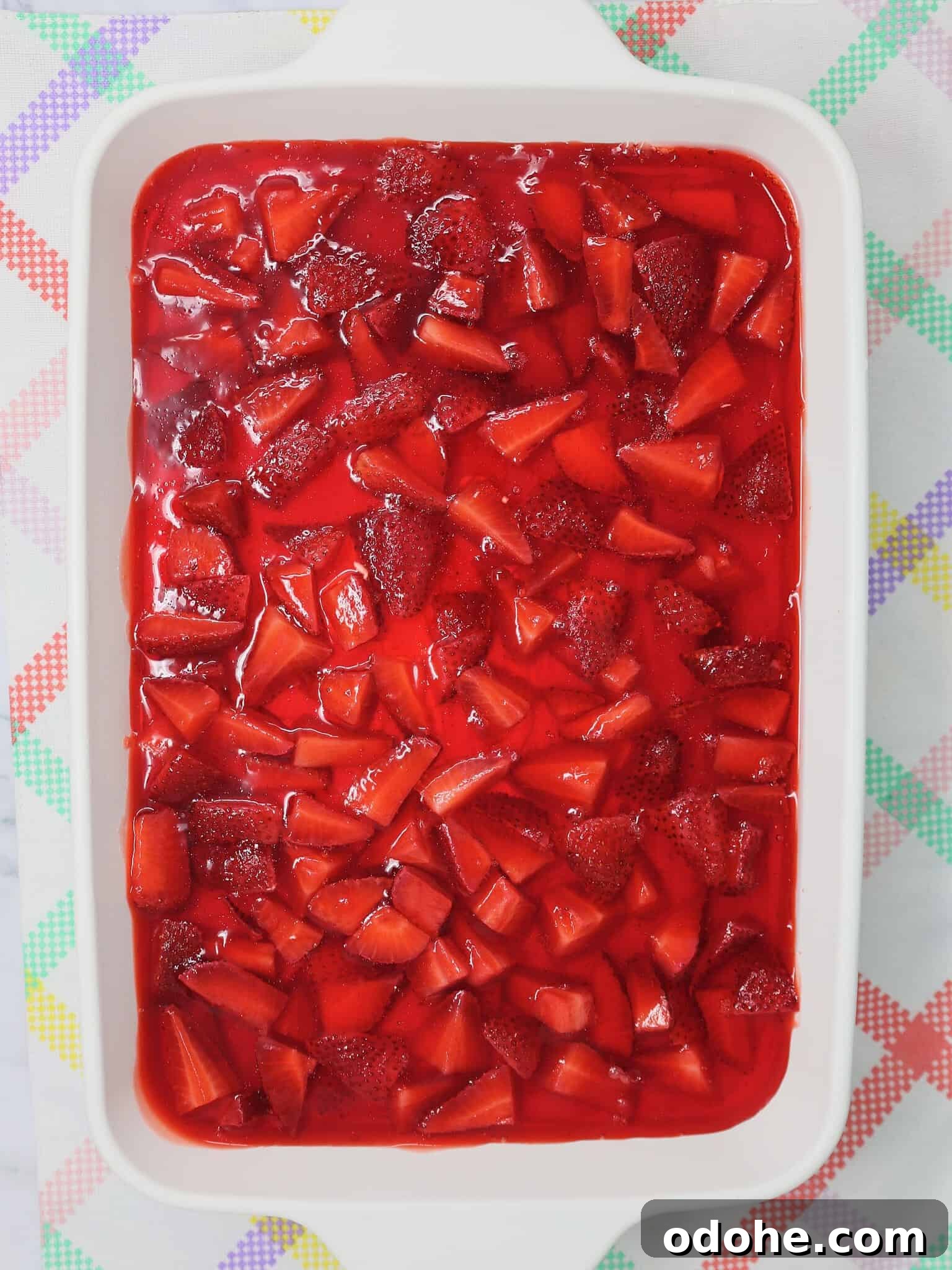 Make-Ahead Strawberry Pretzel Salad with Fresh Berries 3 Overhead view of homemade strawberry pretzel salad in a 9x13 dish ready to serve at a potluck
