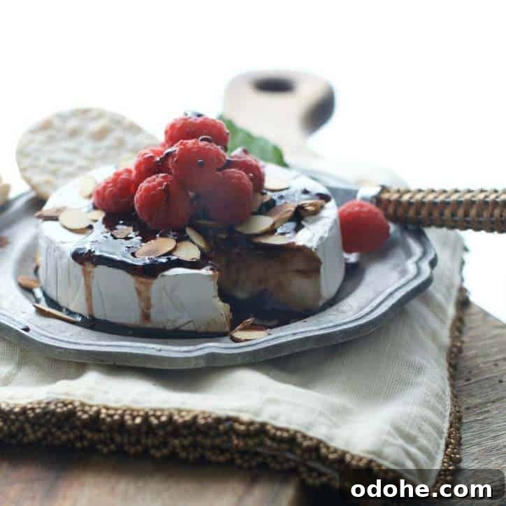 Toasted Almond and Raspberry Baked Brie Recipe for Entertaining 6 A photo of Toasted Almond Raspberry Baked Brie in fading sunlight