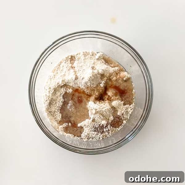 Gluten-Free Snickers Copycat Recipe: Homemade Chocolate Caramel Nougat 6 Adding the cookie layer ingredients to a mixing bowl.
