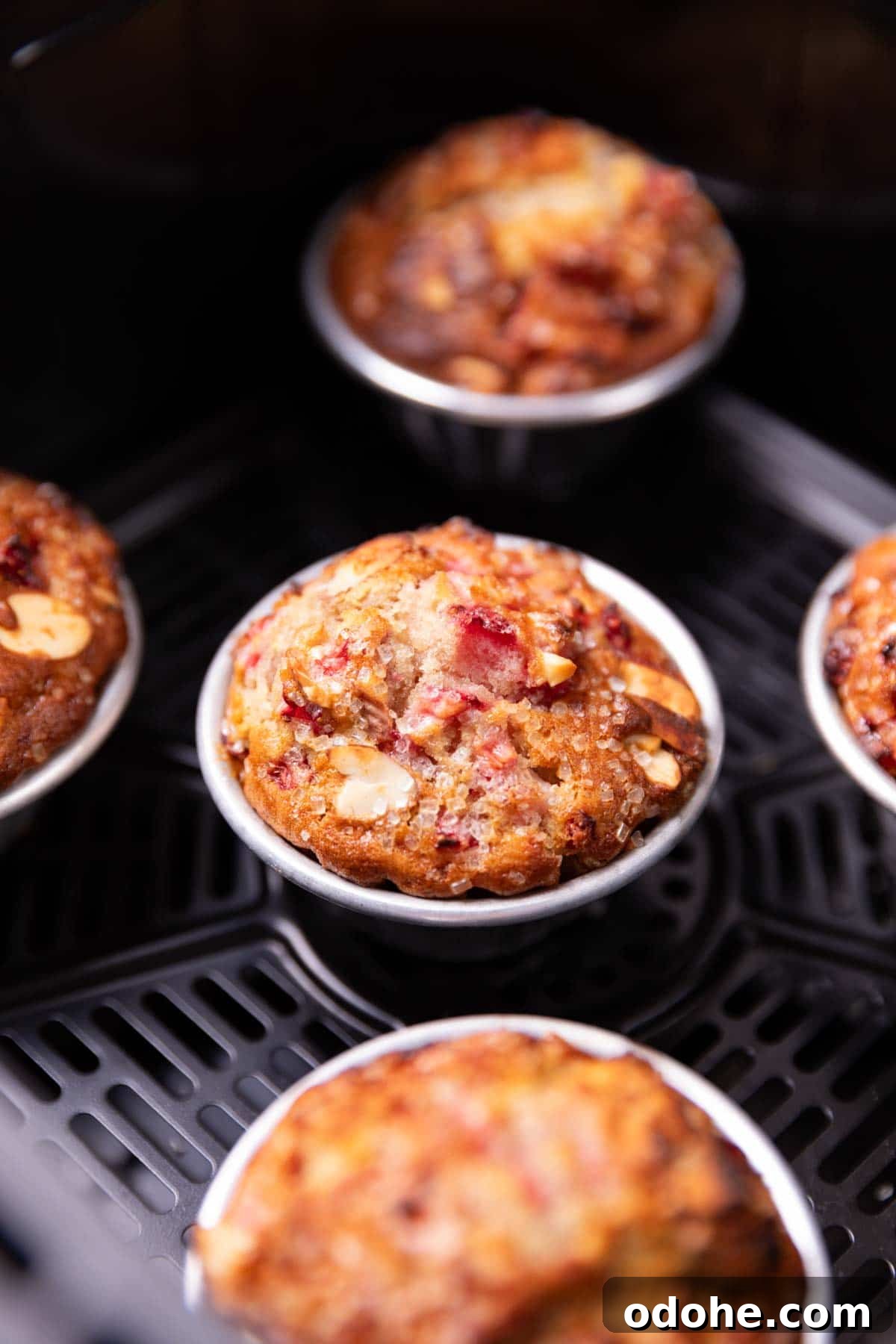 Air Fryer Strawberry Muffins Recipe for Moist, Quick Bakes 2 closeup image of freshly baked strawberry muffins in an air fryer