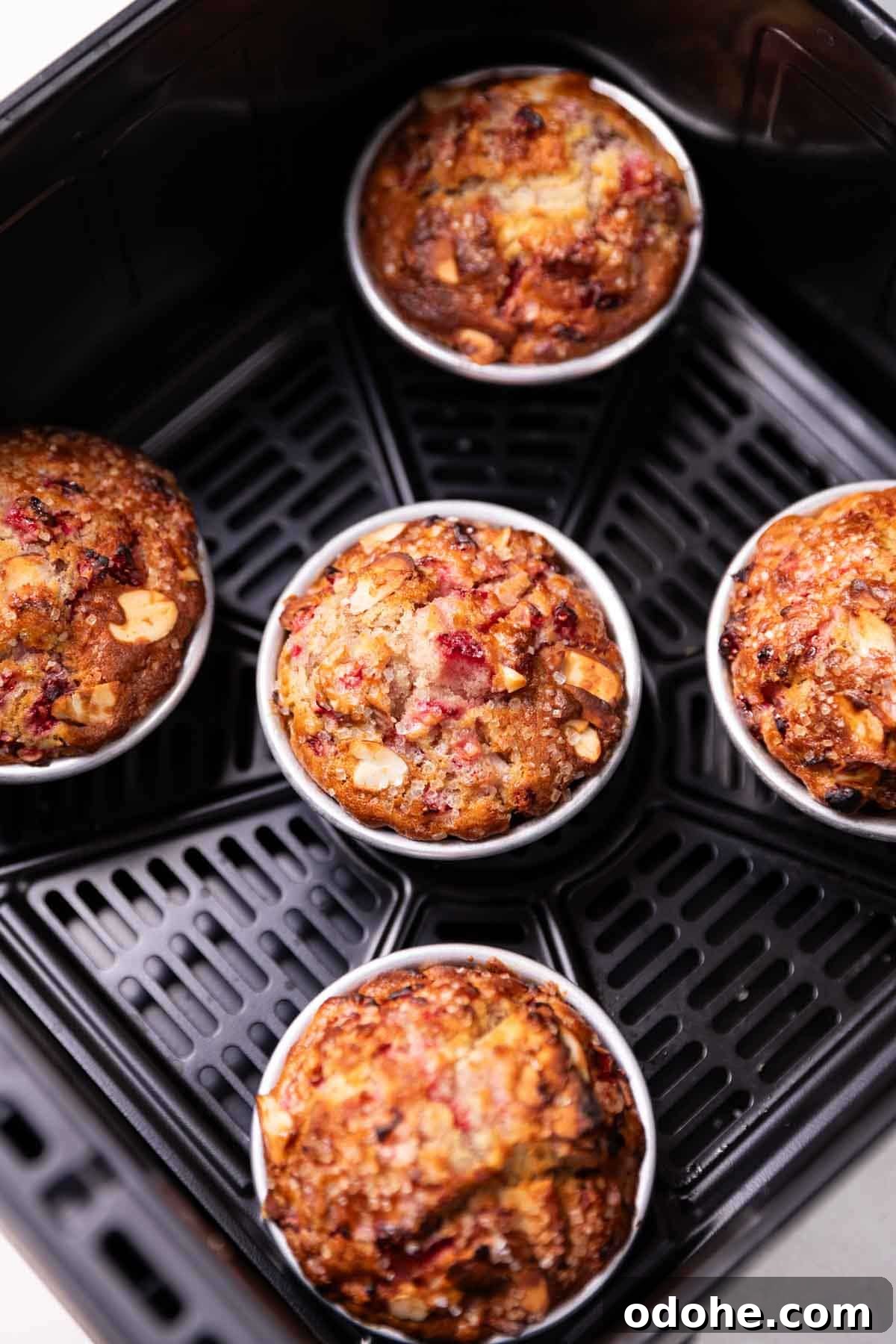 Air Fryer Strawberry Muffins Recipe for Moist, Quick Bakes 3 freshly baked strawberry muffins in an air fryer
