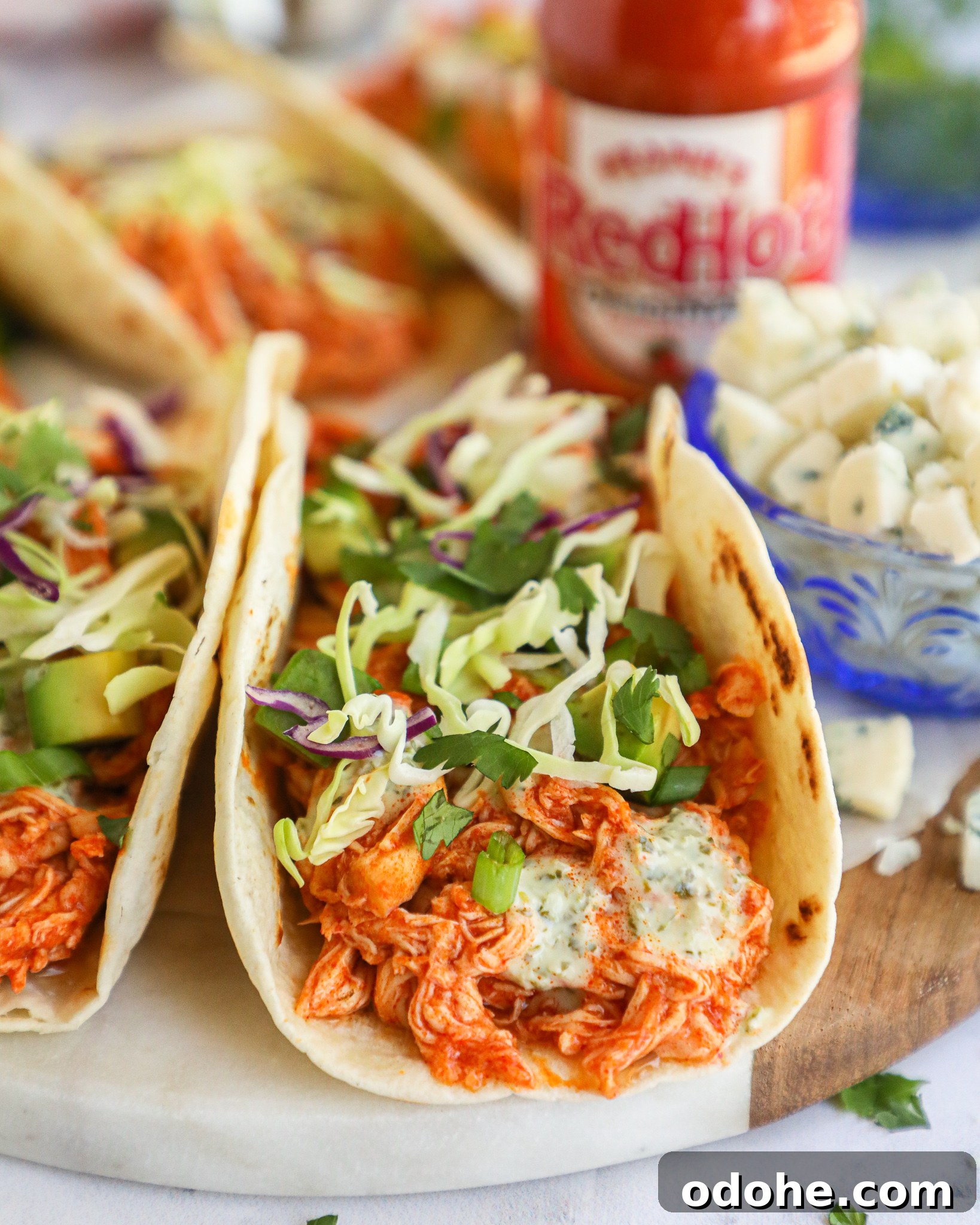 Baked Buffalo Chicken Tacos with Cilantro-Lime Crema 5 Are you a buffalo chicken lover? Then you're going to absolutely love these spicy buffalo tacos! They're so simple and are perfect for a quick dinner or lunch!