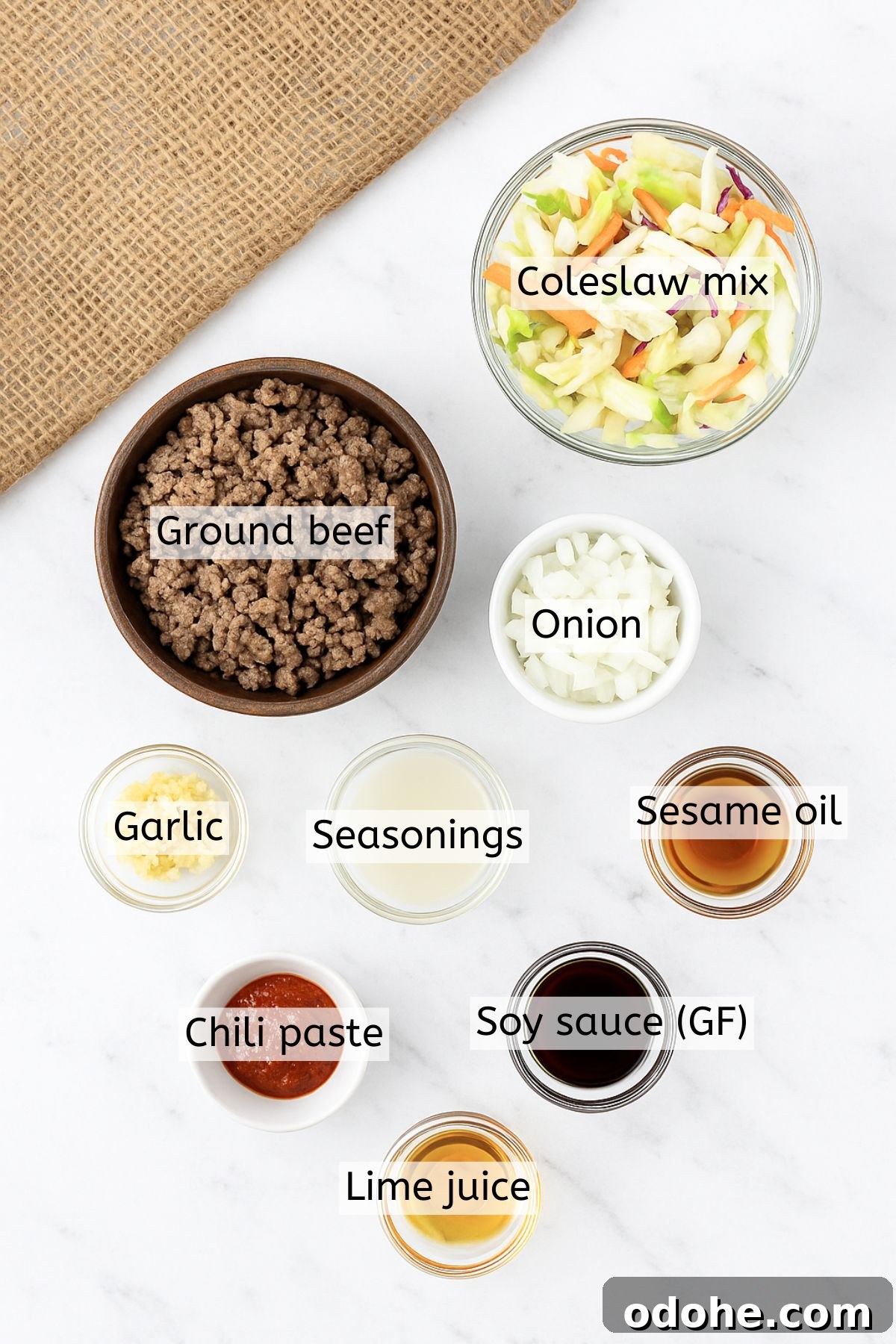 Gluten-Free Inside-Out Egg Roll Recipe: Crispy, Flavorful Wraps 3 Ingredients like ground beef, seasonings, sesame oil, and coleslaw in bowls with text labels over top.