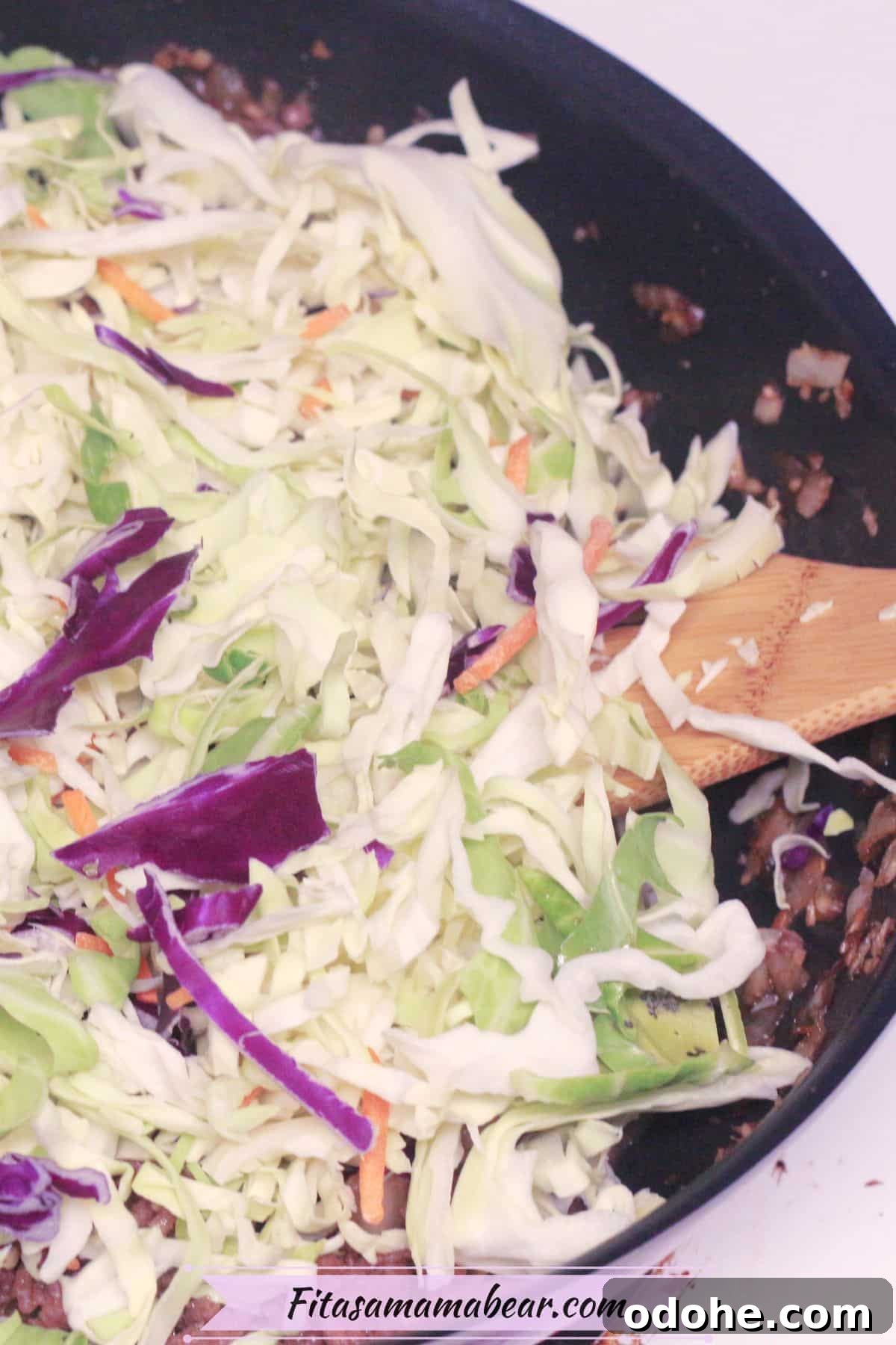 Gluten-Free Inside-Out Egg Roll Recipe: Crispy, Flavorful Wraps 6 Black skillet with coleslaw in it and ground beef.
