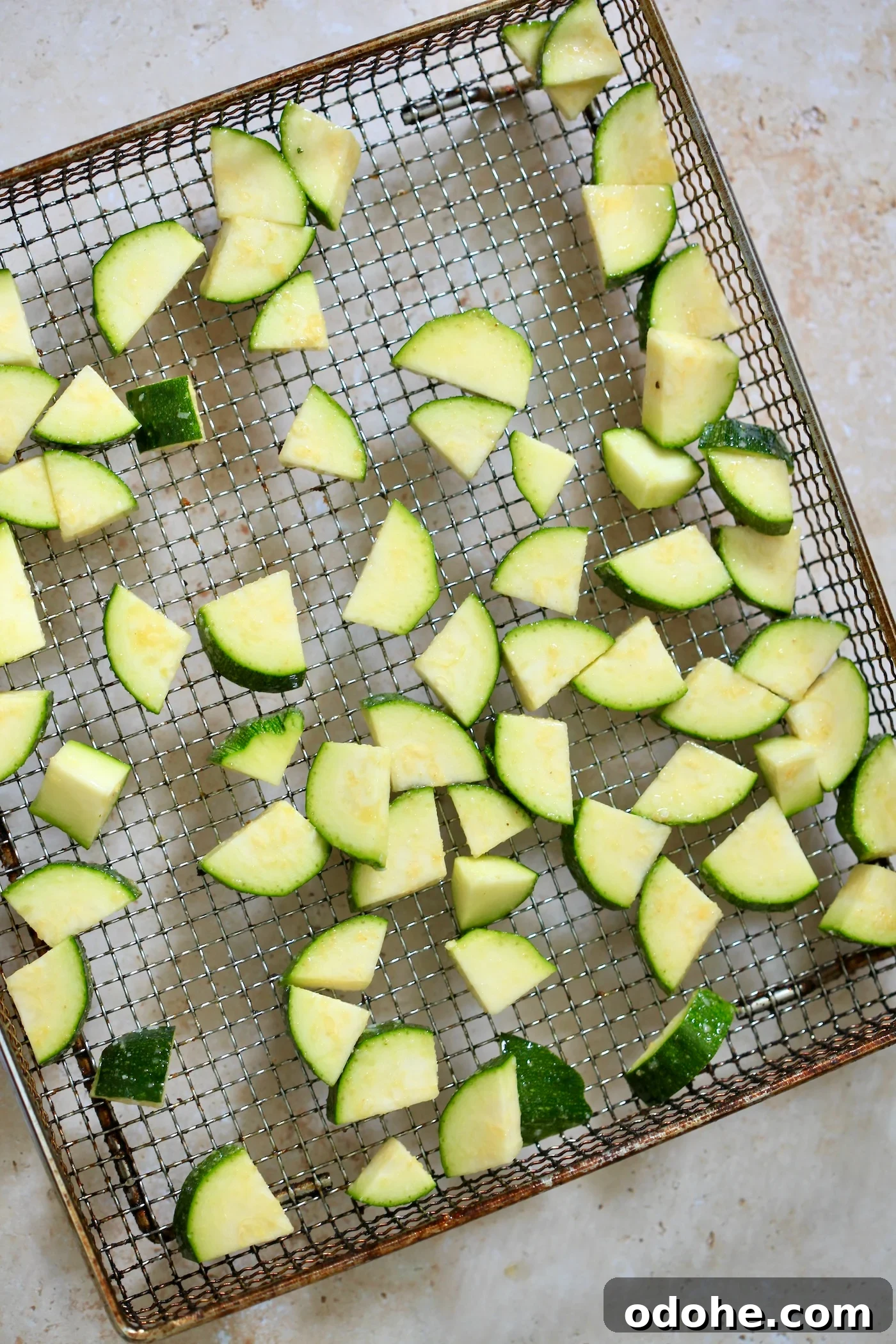 Zucchini, Quinoa & Chickpea Salad with Feta and Fresh Dill 4 raw zucchini on air fryer tray.