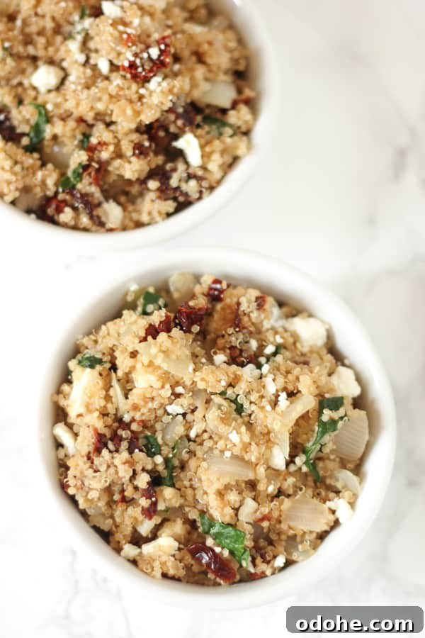 This Mediterranean Quinoa is packed with sun-dried tomatoes & feta! It's a super easy side or main dish 