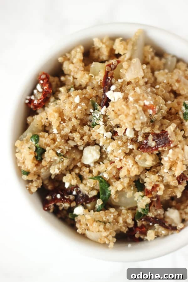 This Mediterranean Quinoa is packed with sun-dried tomatoes & feta! It's a super easy side or main dish 