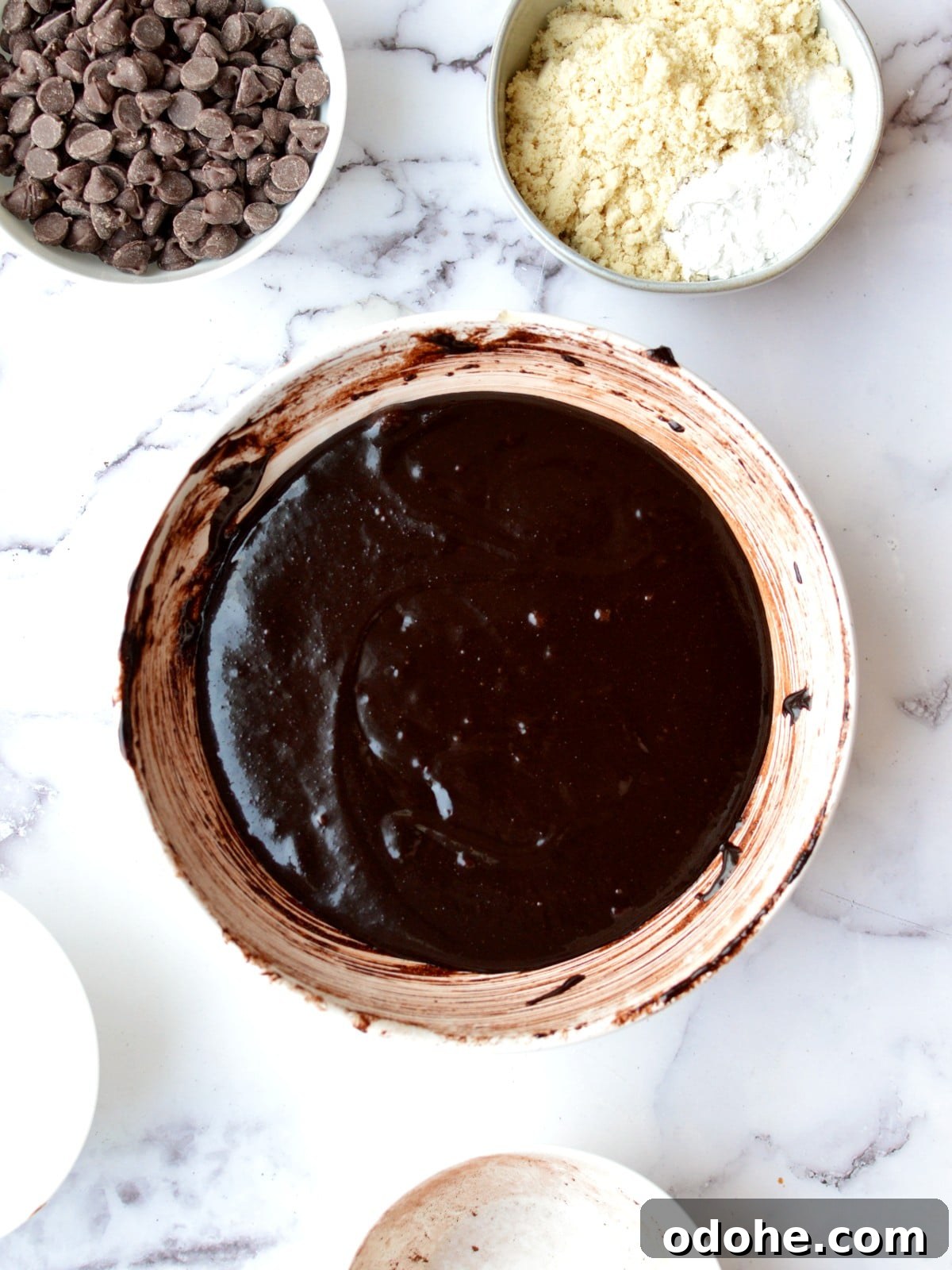 Fudgy Almond Flour Brownies Recipe — Gluten-Free Chocolate Treat 5 a bowl of gluten free brownie batter