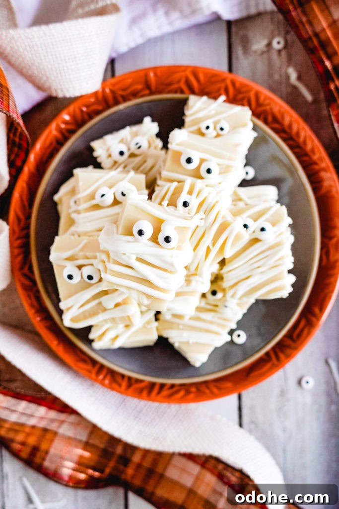 Spooky Halloween Fudge Recipes for Party Treats 4 Top down view of a plate of mummy fudge.