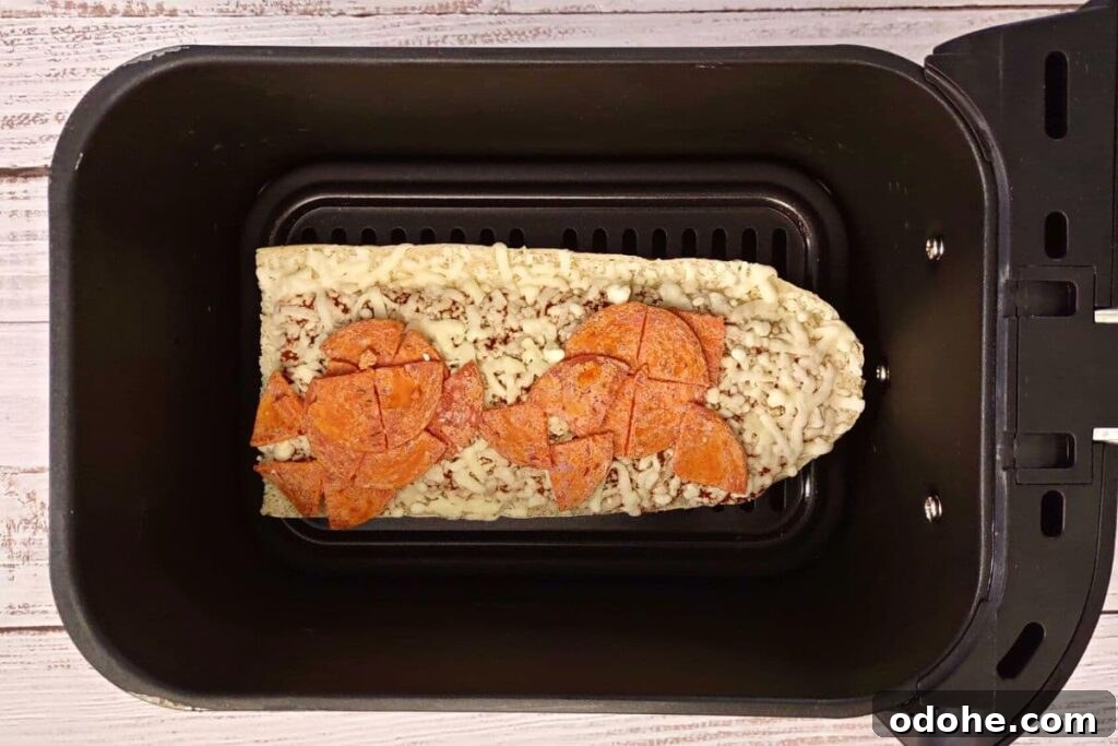 Air Fryer Red Baron French Bread Pizza Recipe in 15 Minutes 5 frozen red baron french bread pizza in air fryer basket