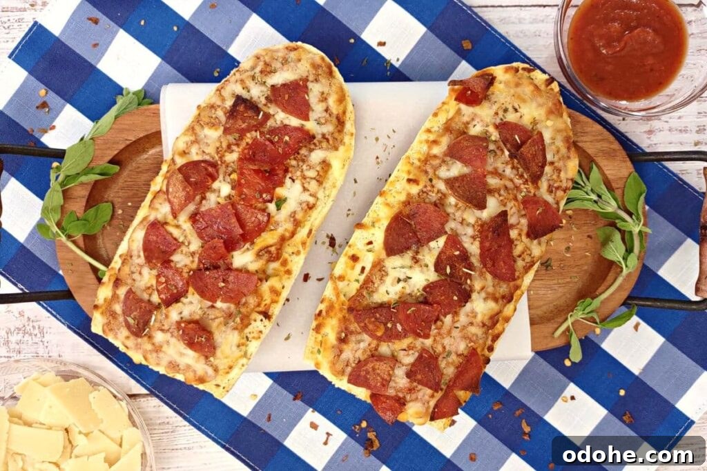 Air Fryer Red Baron French Bread Pizza Recipe in 15 Minutes 6 overhead view of 2 red baron french bread pizza on a serving board