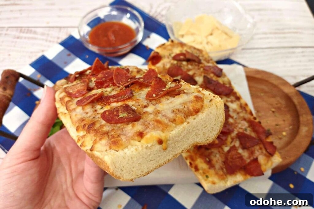 Air Fryer Red Baron French Bread Pizza Recipe in 15 Minutes 7 holding red baron french bread pizza made in the air fryer