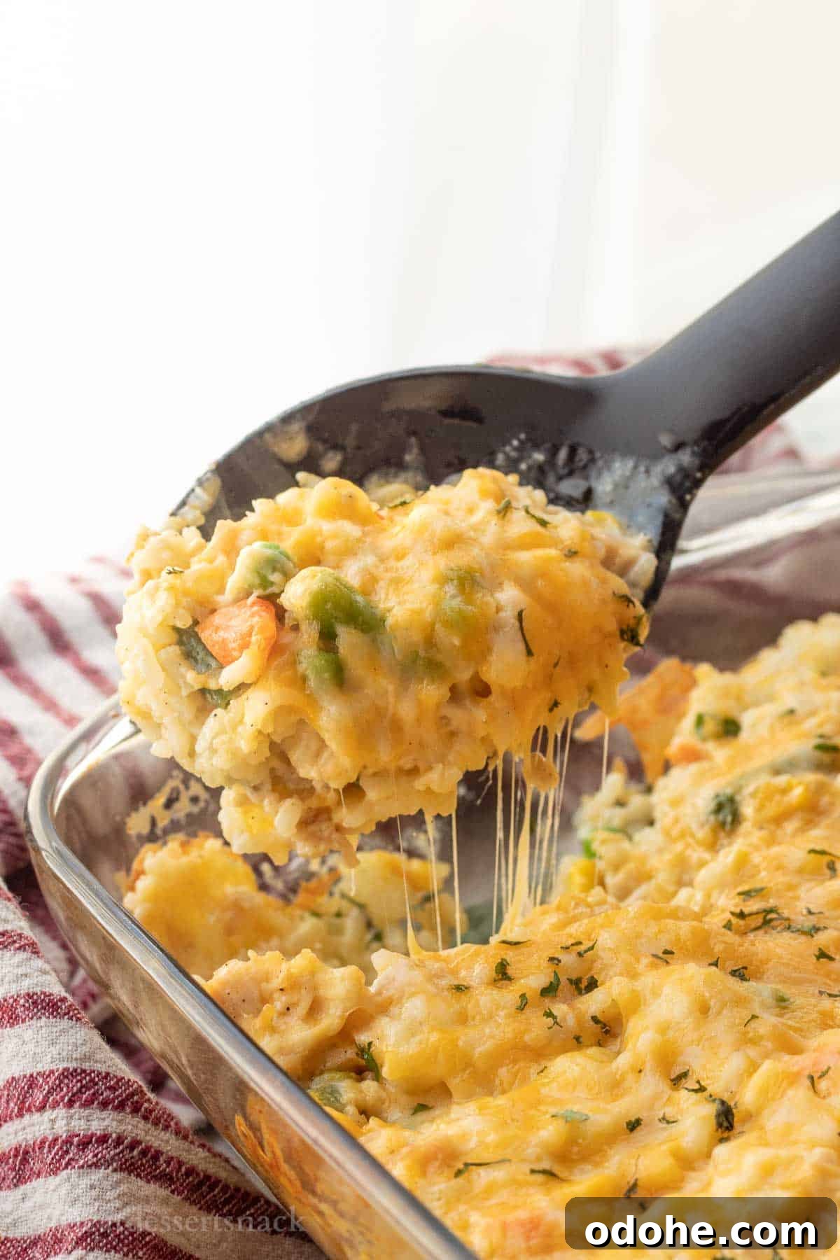 Cheesy Chicken, Rice & Veggie Casserole Recipe 12 Spoonful of melty cheese rice casserole.