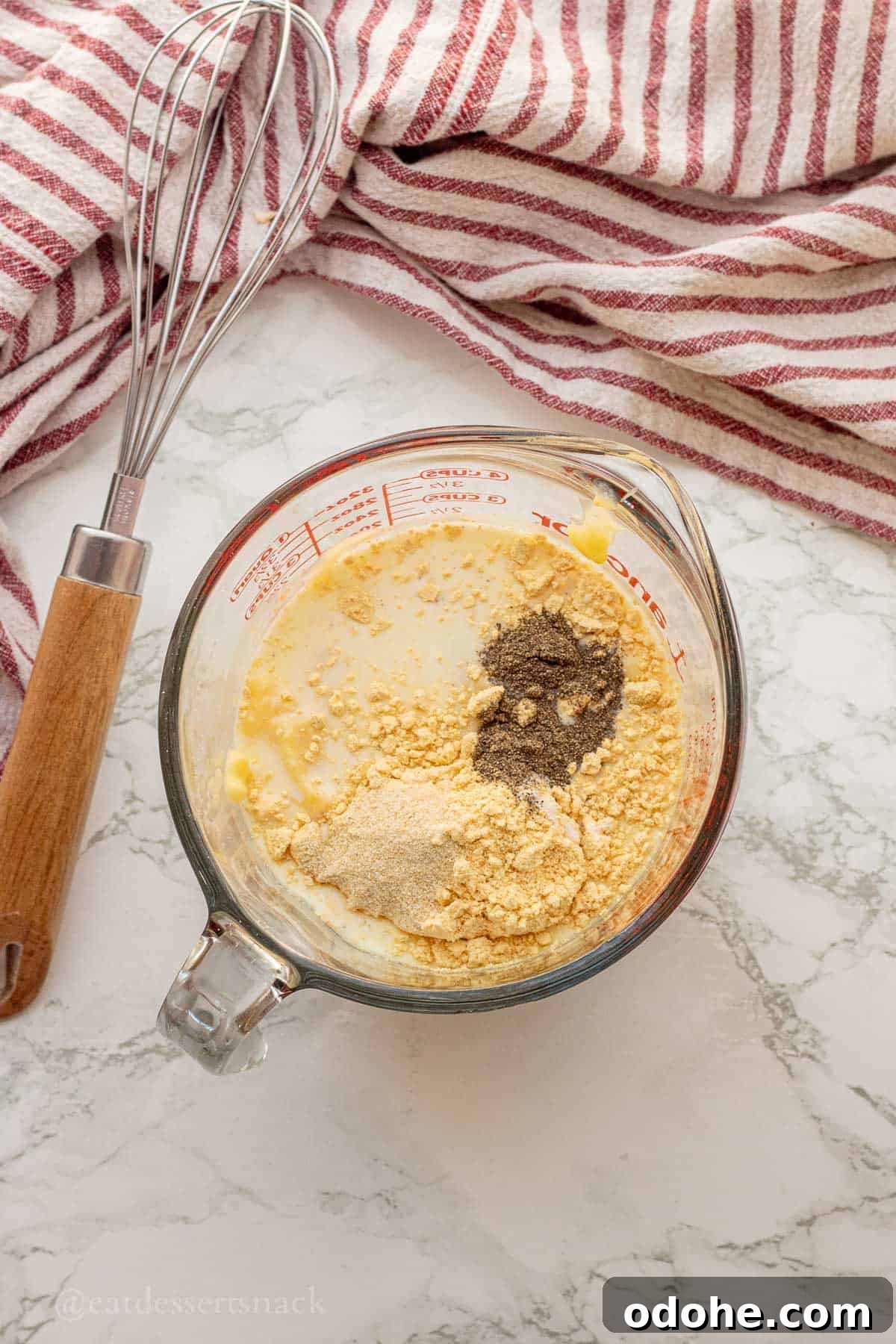 Cheesy Chicken, Rice & Veggie Casserole Recipe 6 Milk, seasonings, and gravy mix in glass measuring cup.