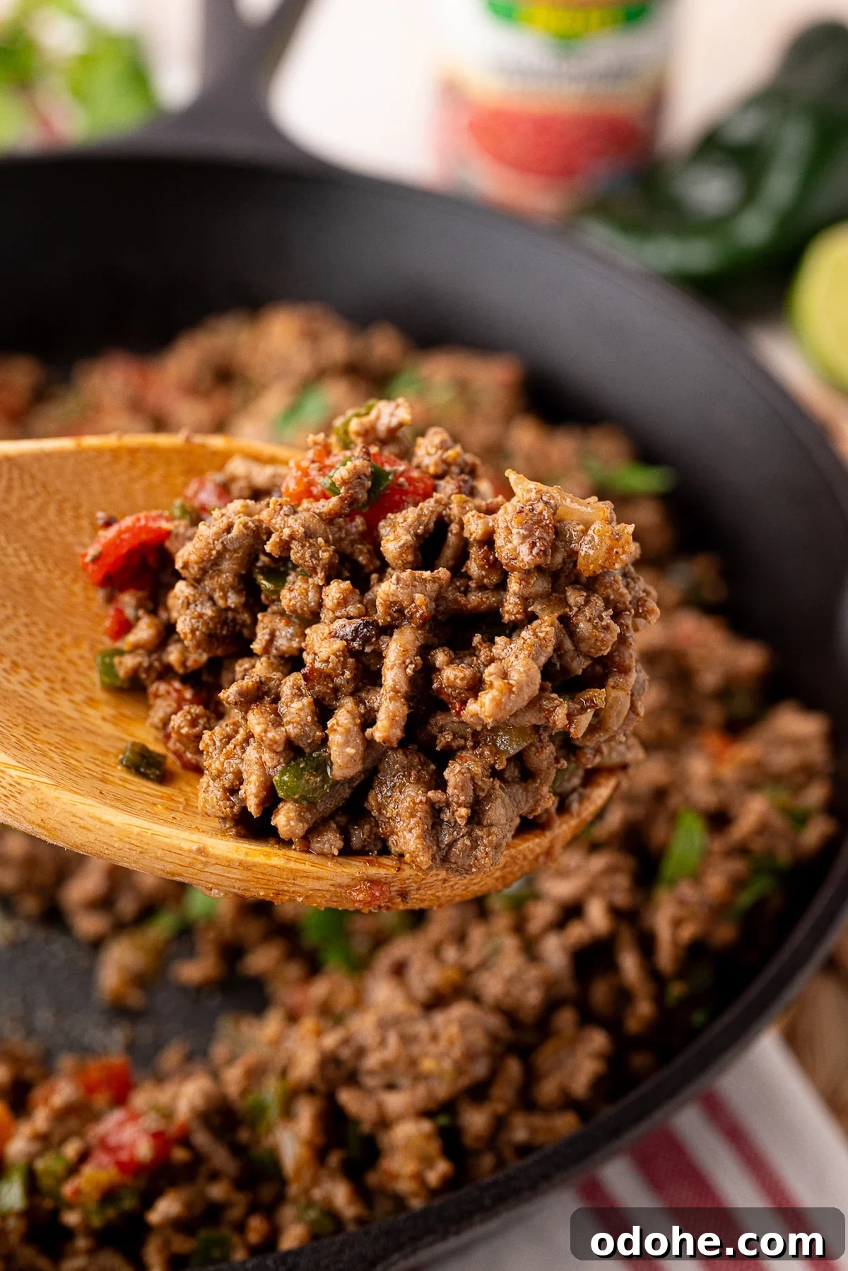 Flavorful Ground Beef Taco Meat Recipe for Authentic Tacos 3 savory ground beef taco meat cooked in cast iron on a wooden spoon