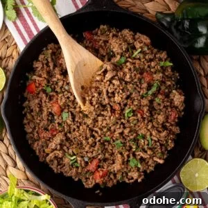 Flavorful Ground Beef Taco Meat Recipe for Authentic Tacos 8 beef taco meat in skillet with visible tomato and cilantro garnish