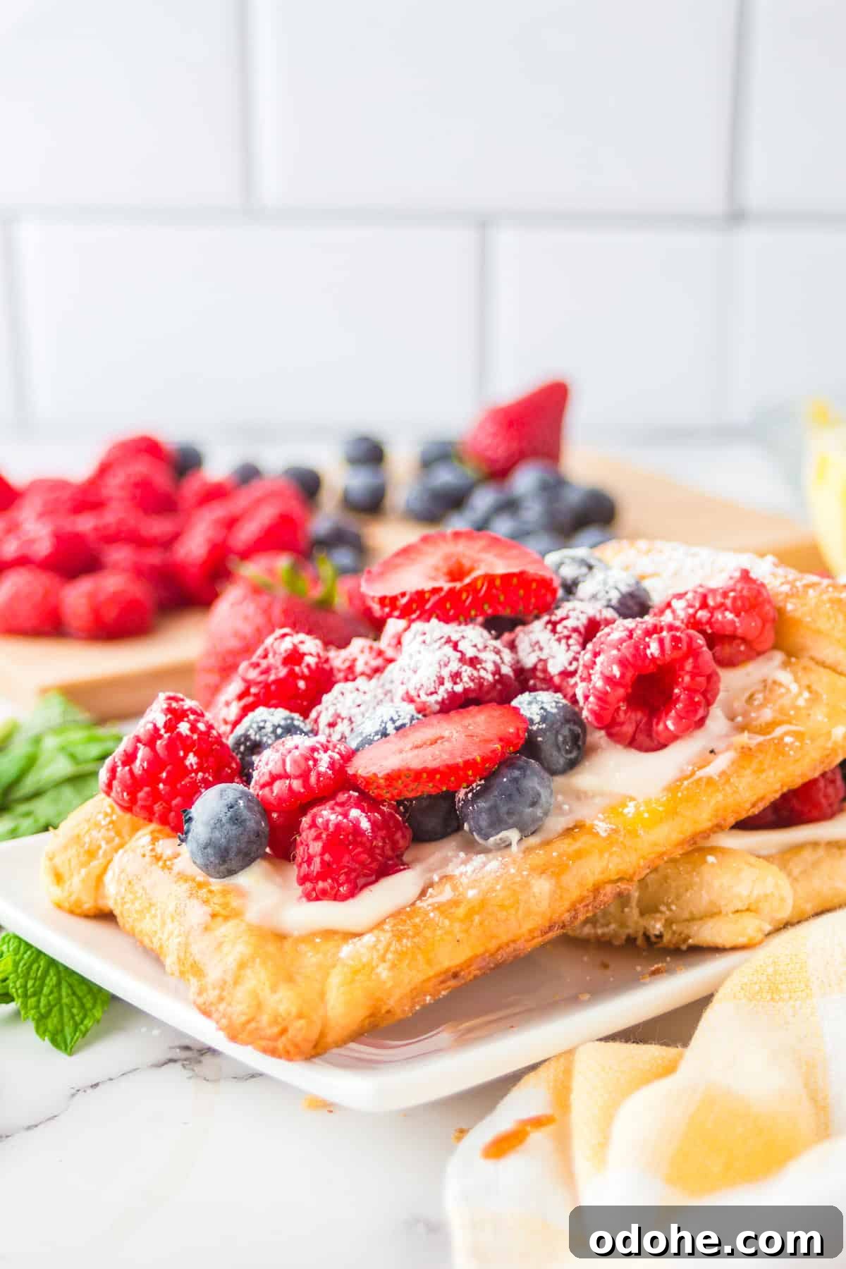 Crescent Dough Berry Tart: Quick Recipe for Flaky Fruit Tarts 2 Close up of one finished and stacked Berry Tart