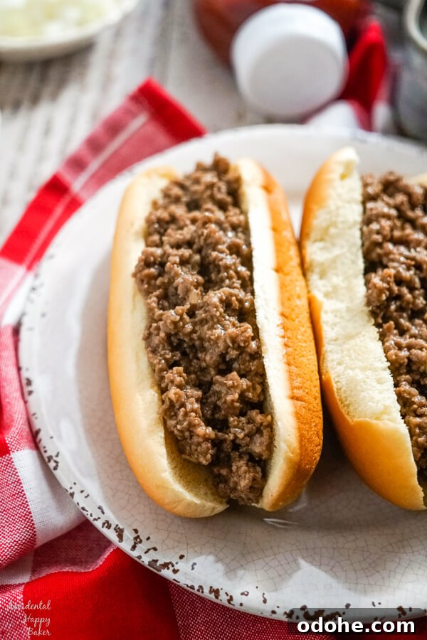 Juicy Midwestern Loose Meat Sandwich Recipe for Classic Burgers 4 Two loose meat sandwiches on a white plate.