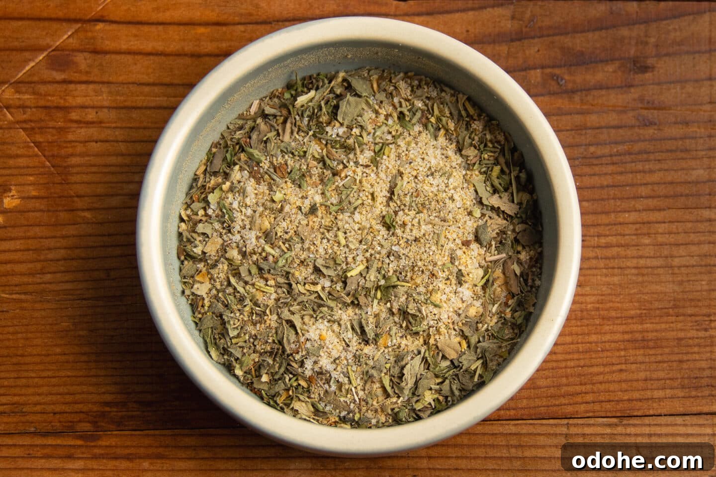 This is a picture of a small bowl filled with spices and herbs.