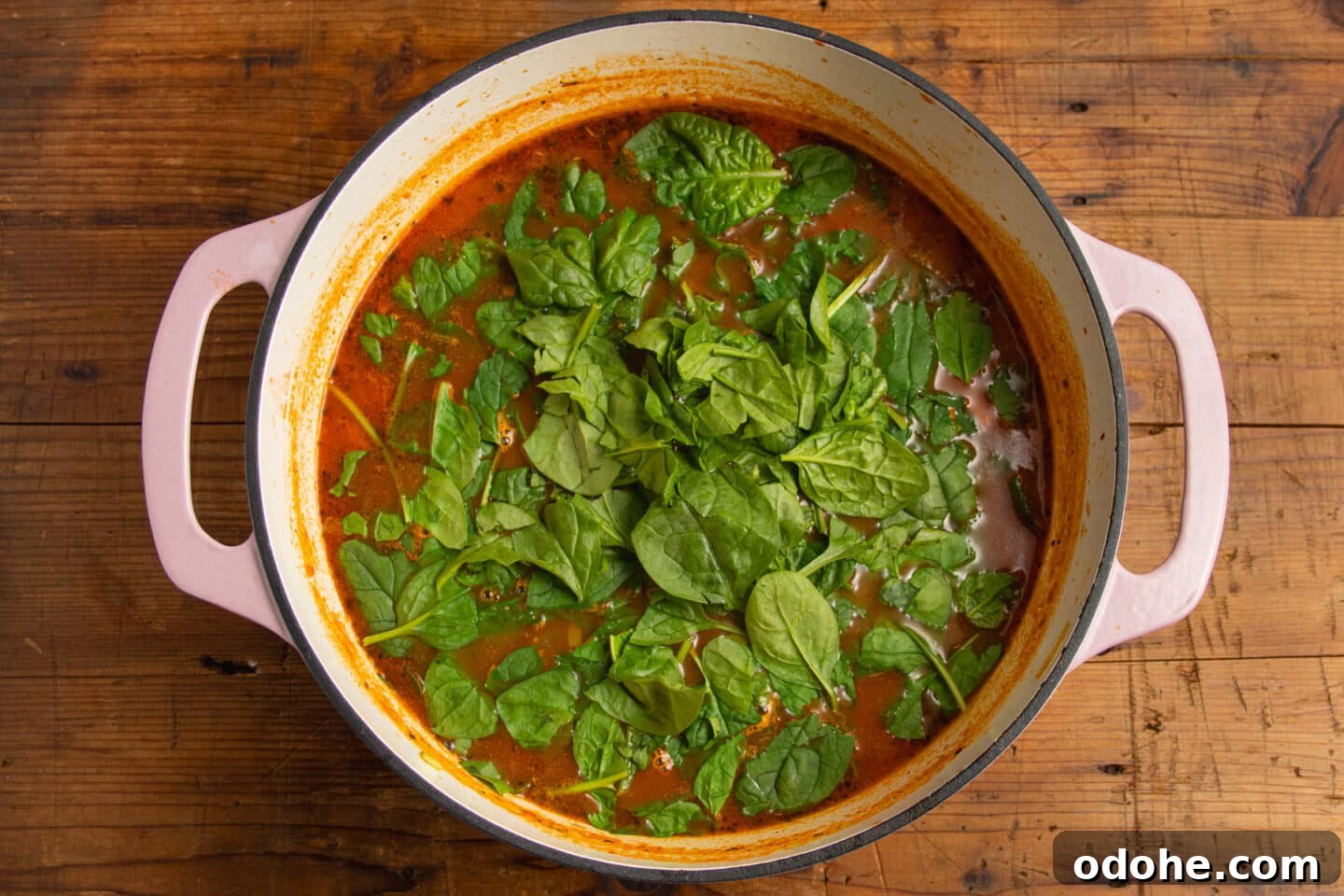 This is a picture of the pot of soup with the spinach and lemon added.