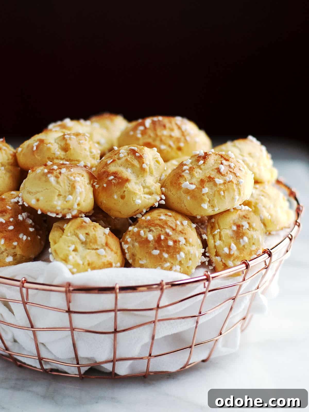 Choquettes served in a cloth lined copper basket