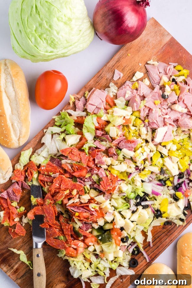 Crispy Chopped Italian Sandwich + Fix for Soggy Buns 6 Chopped Italian Sandwich ingredients on a cutting board
