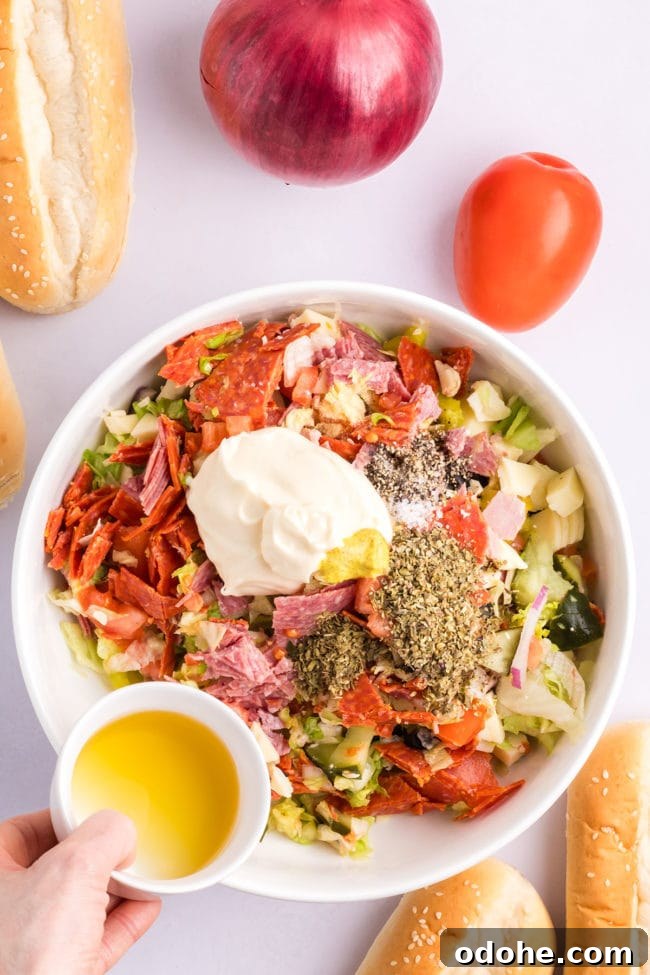 Crispy Chopped Italian Sandwich + Fix for Soggy Buns 7 adding Italian dressing to chopped sandwich ingredients