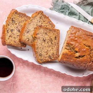 High protein banana nut bread on a platter served with coffee.