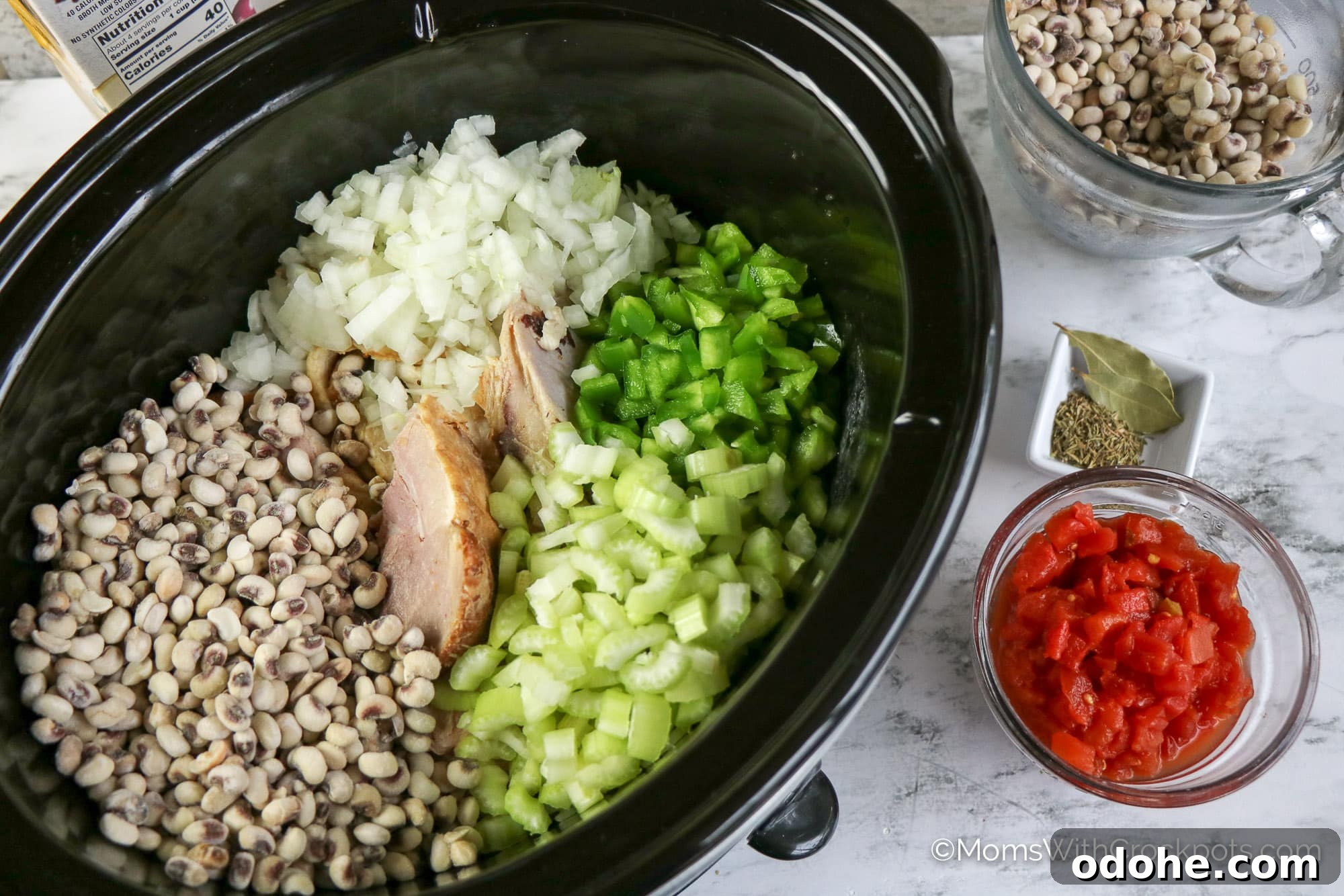 Slow Cooker Hoppin' John Recipe — Classic Southern Black-Eyed Peas 4 Slowcooker with ham, black eyed peas, onions, celery and bel pepper
