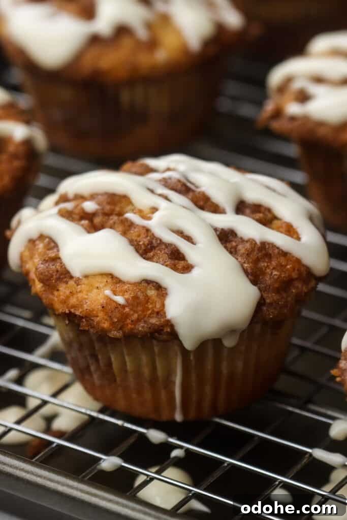 cinnamon roll muffins lined on a tray.