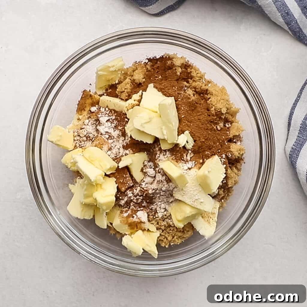 Ingredients for cinnamon roll muffins filling in a bowl.