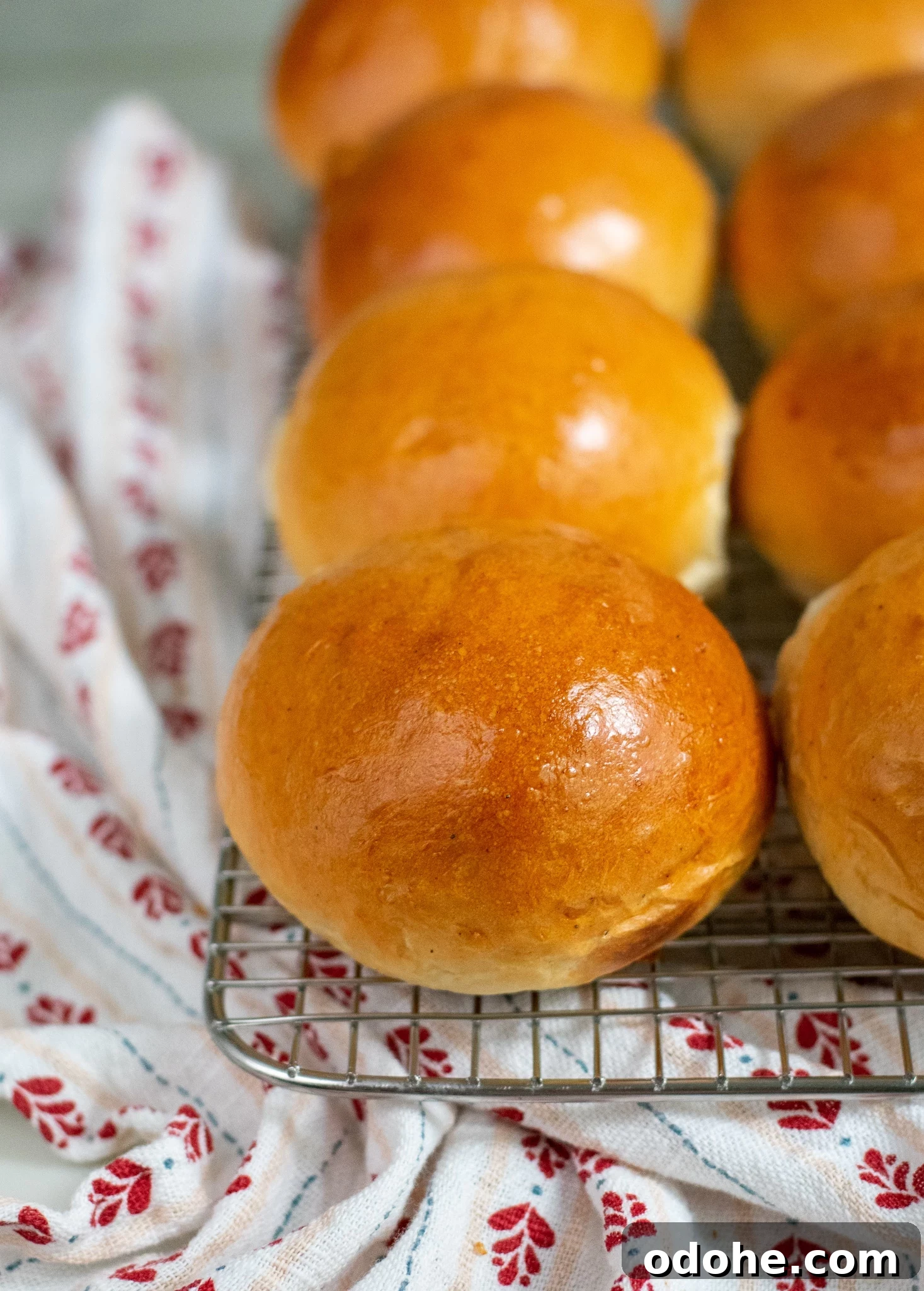 Skandibaking Turns Two: Anniversary Recipes and Scandinavian Treats 2 Cardamom rolls on a cooling rack.