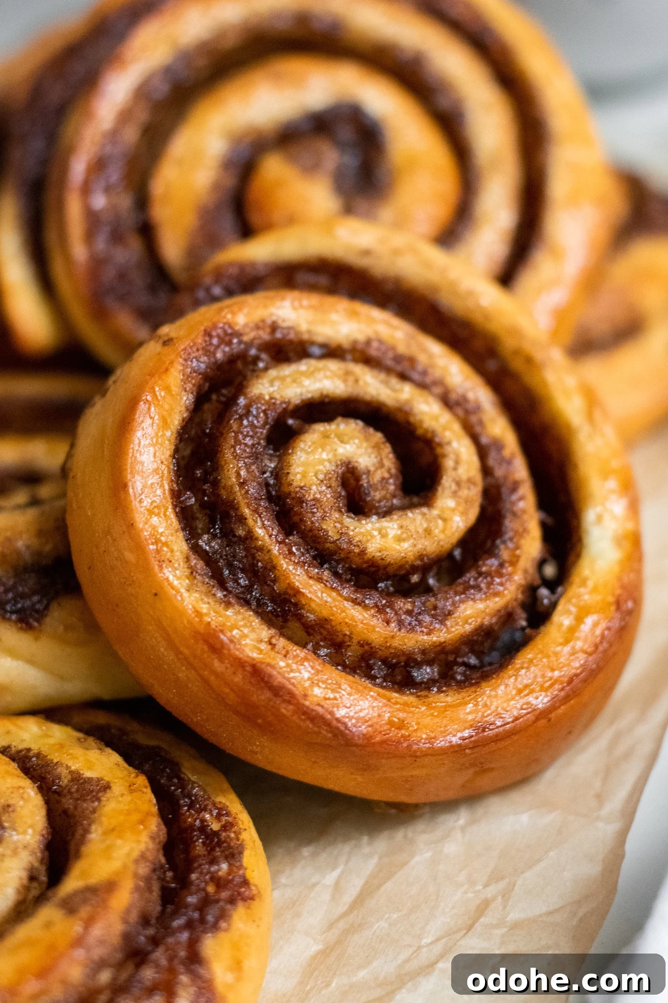 Skandibaking Turns Two: Anniversary Recipes and Scandinavian Treats 3 Cinnamon rolls in a pile.