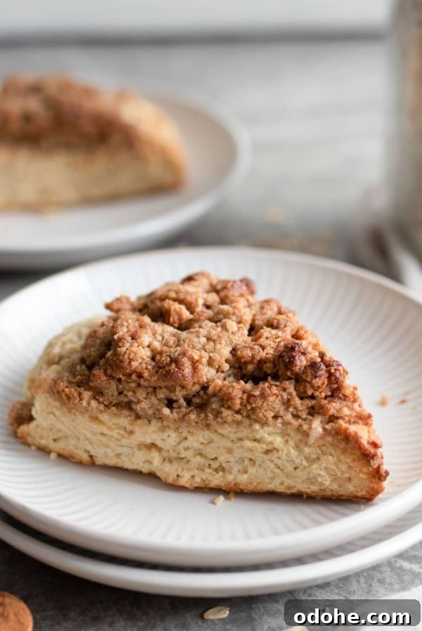 A cinnamon scone on a plate.