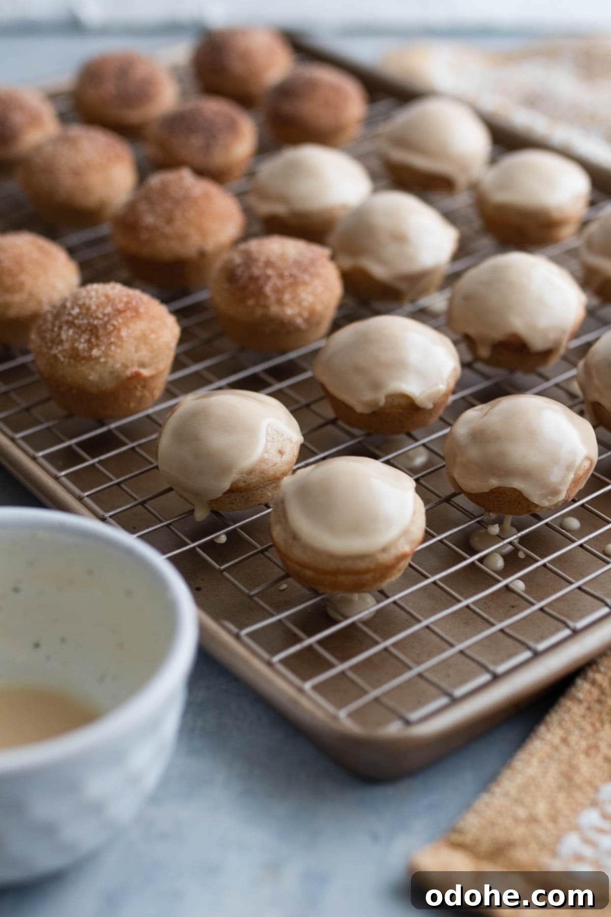 Pouring glaze onto donut holes.