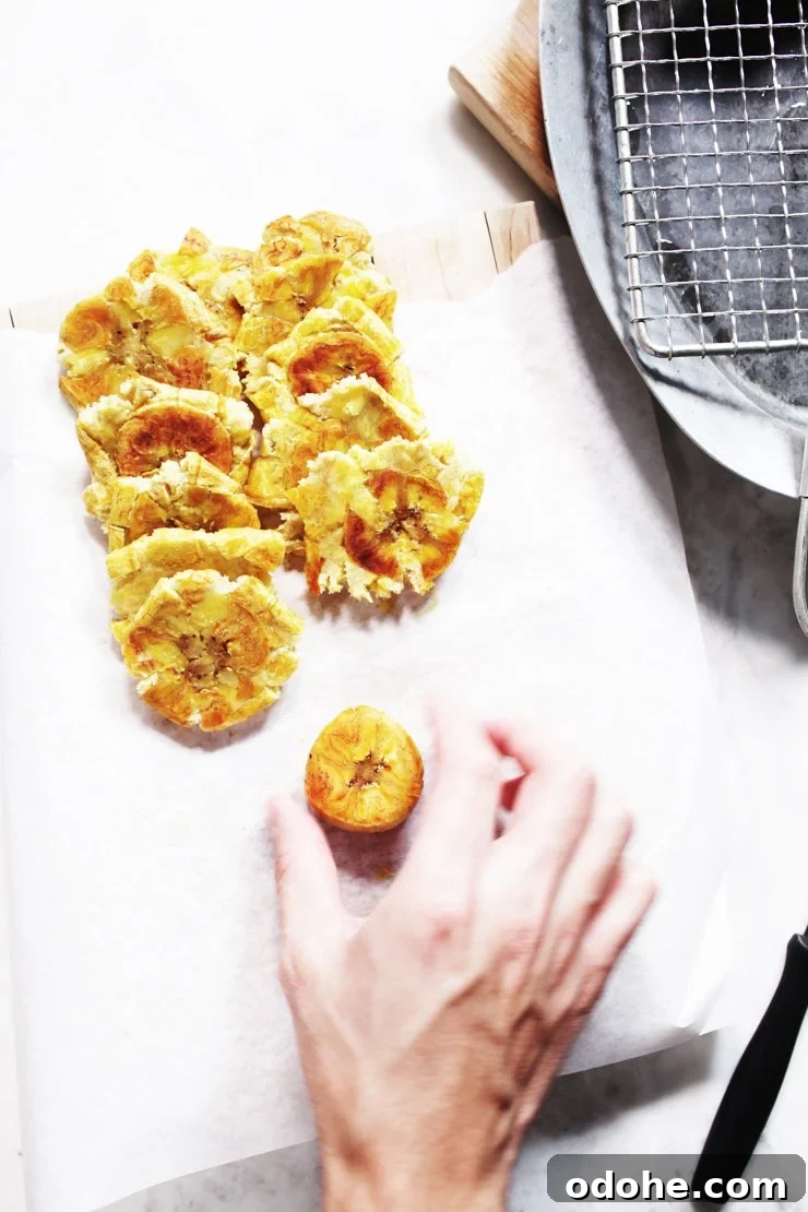 Smashing Plantains For Tostones