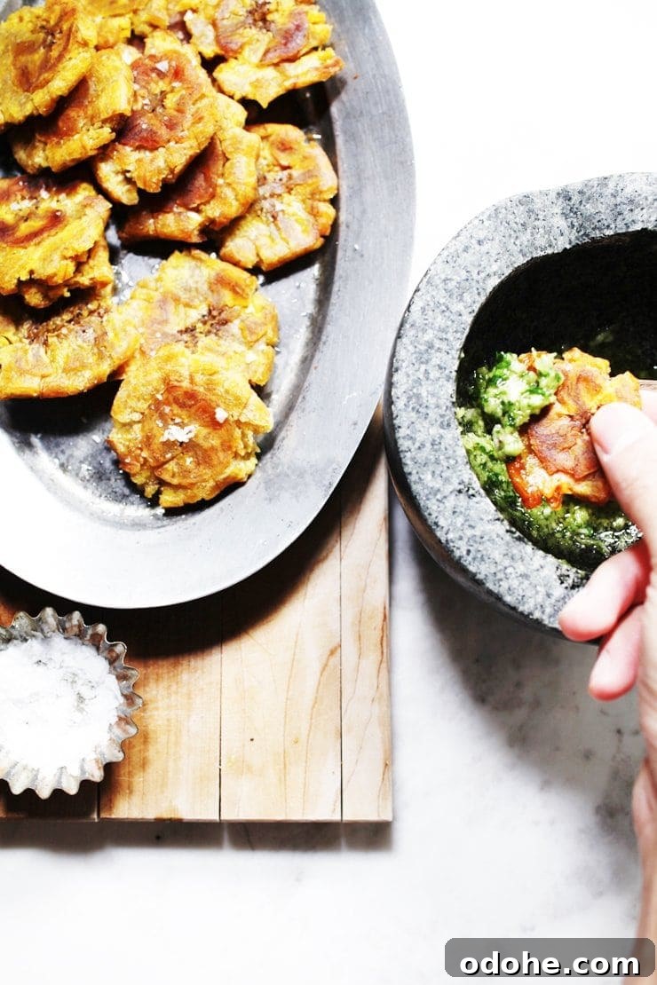 Dipping Dominican Tostones in Cilantro Ajillo