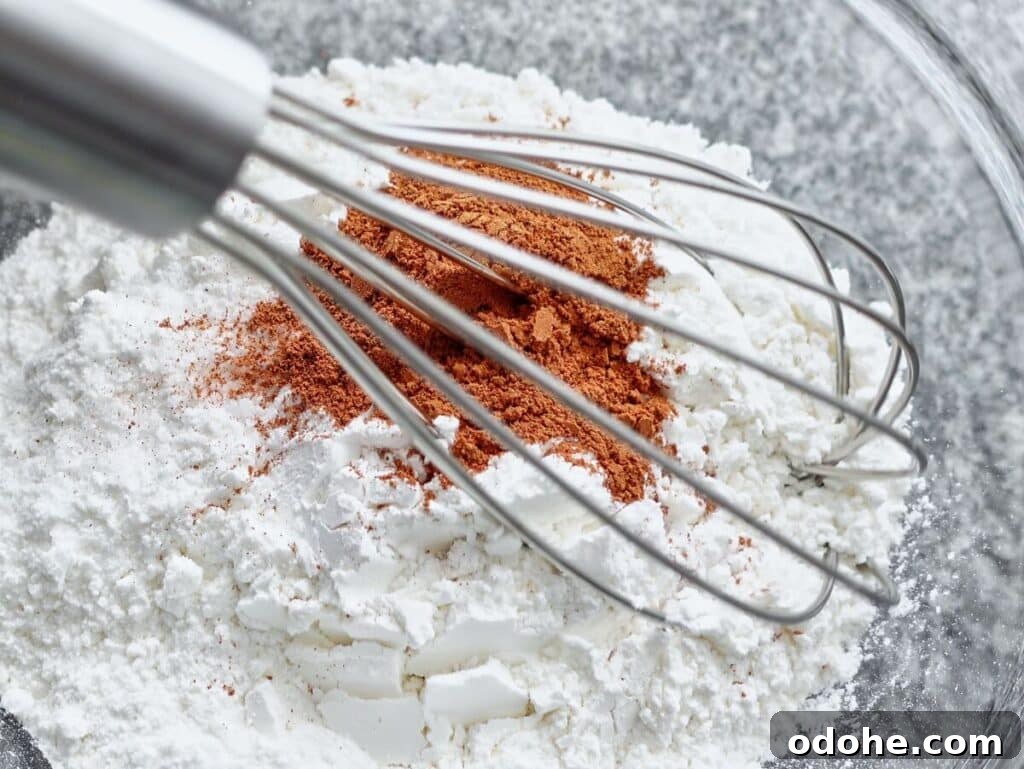 whisking together dry ingredients.