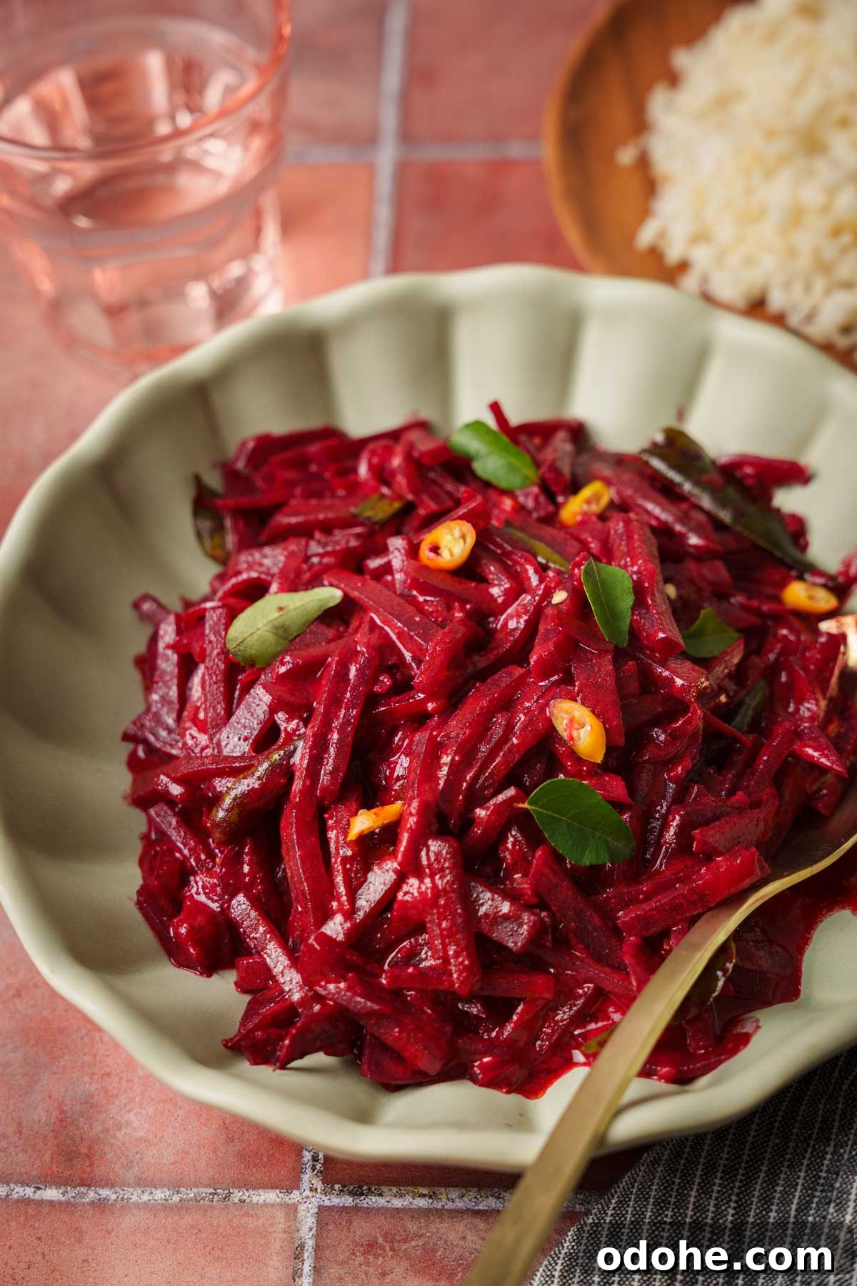 Authentic Sri Lankan Beetroot Curry Recipe with Coconut Milk 2 sri lankan beetroot curry in. a bowl with rice on the side.