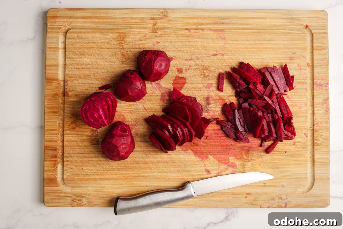 Authentic Sri Lankan Beetroot Curry Recipe with Coconut Milk 4 beetroot cut into thin strips on the cutting board.
