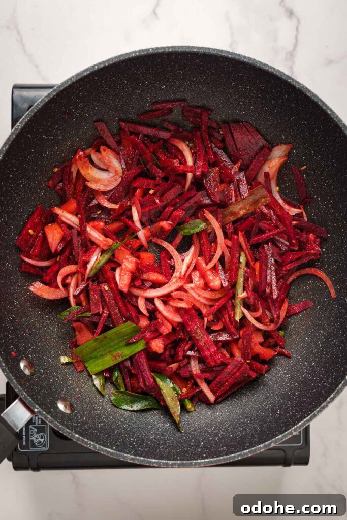 Authentic Sri Lankan Beetroot Curry Recipe with Coconut Milk 6 sauteing the vegetables in the pot.