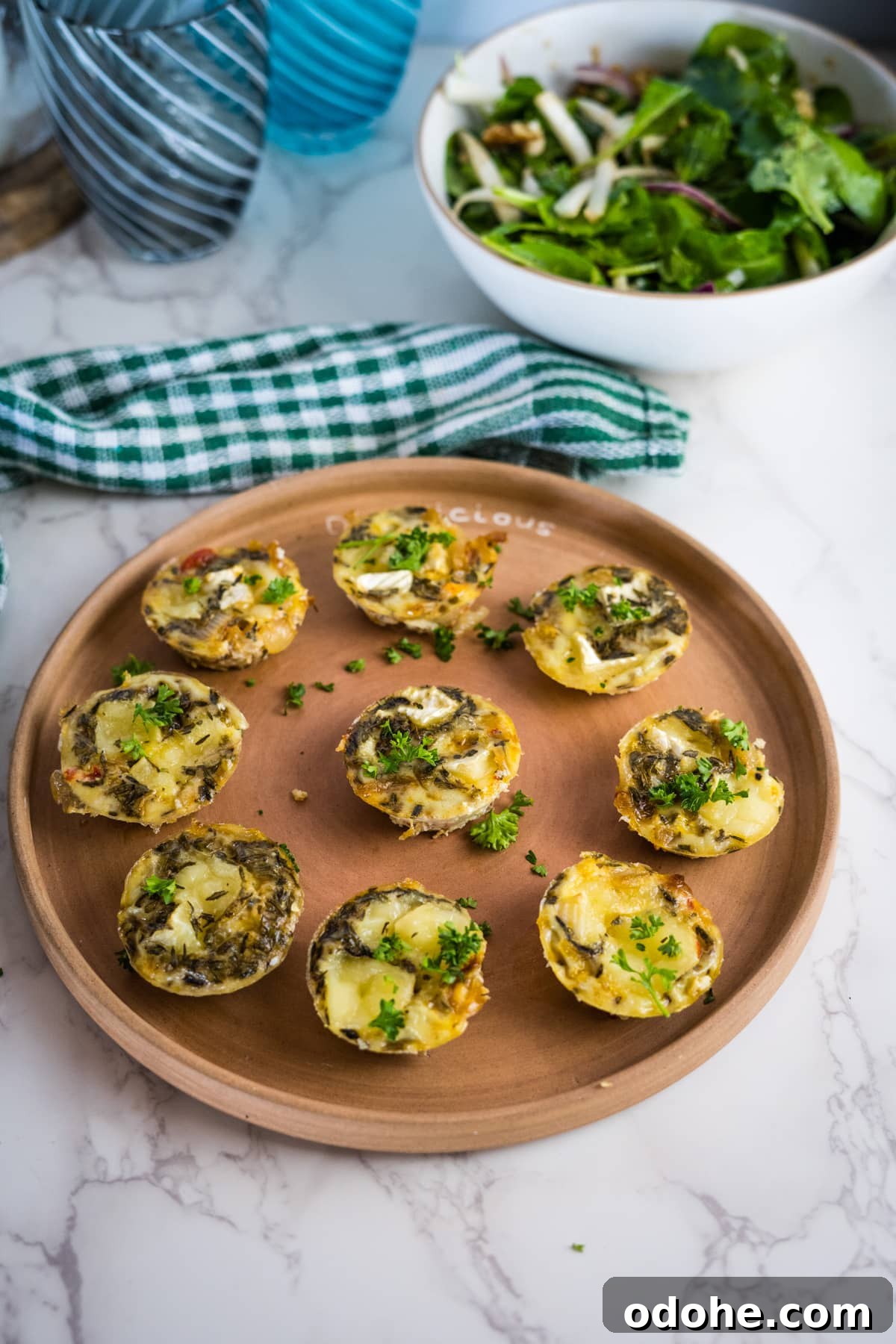 Brie and Caramelized Onion Mini Crustless Quiches: Savory Bites for Brunch 2 mini onion quiche on a plate