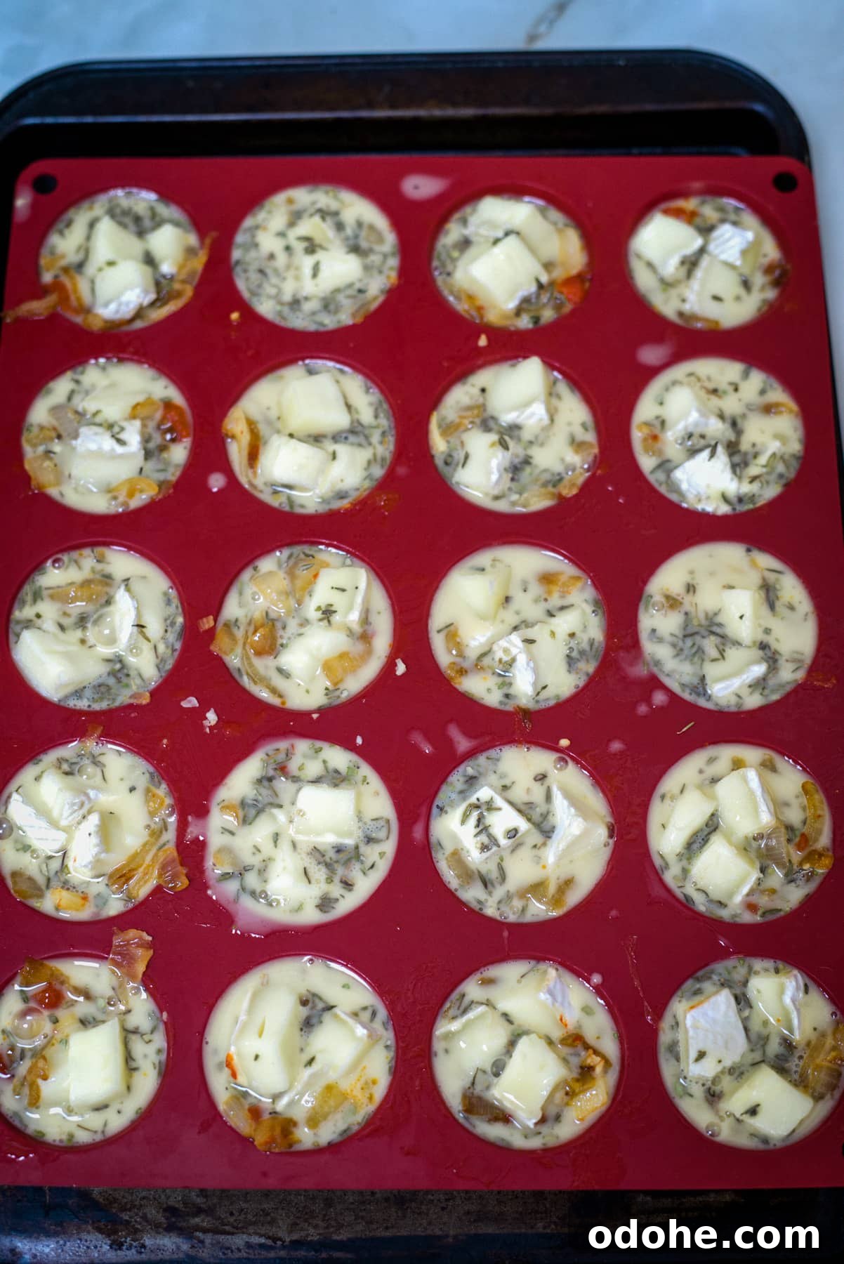 Brie and Caramelized Onion Mini Crustless Quiches: Savory Bites for Brunch 7 filled mini quiche cases