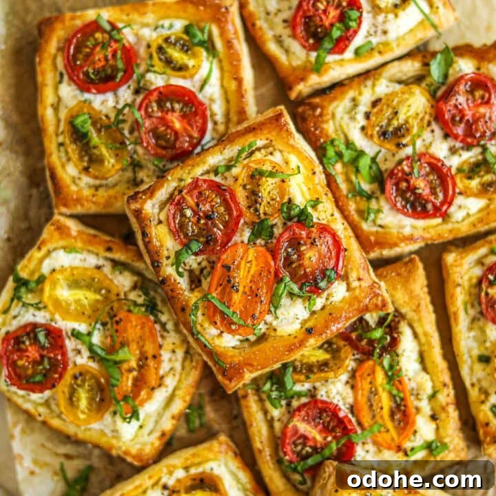 Closeup shot of ricotta tomato tartlets with puff pastry.