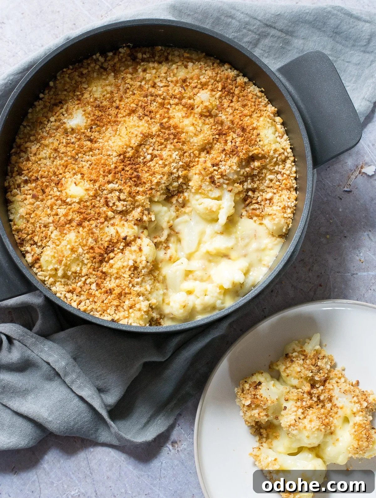 Creamy Vegan Cauliflower Cheese Bake — Plant-Based Comfort Dish 2 Scooped out portion of Vegan Cauliflower Cheese