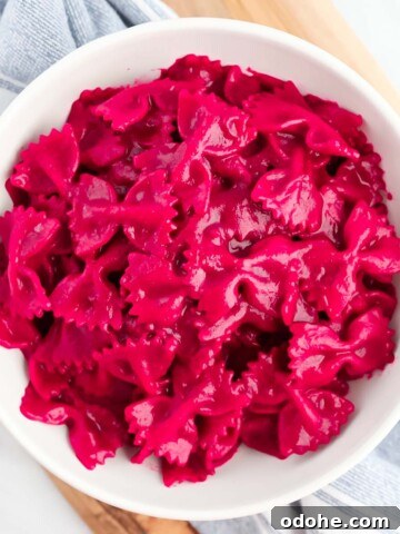 A bowl filled with bright pink pasta.