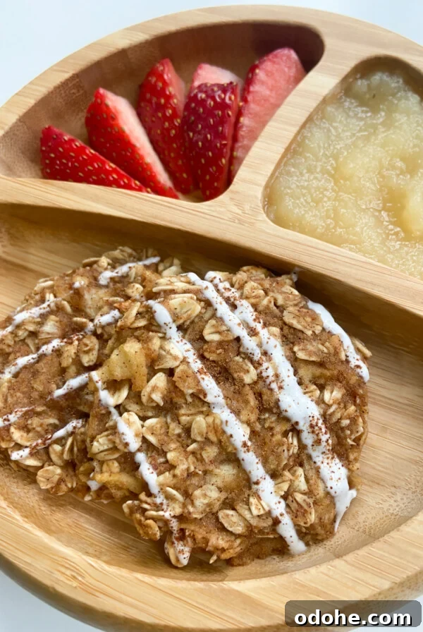 Cinnamon apple oatmeal cookies served with strawberries and applesauce