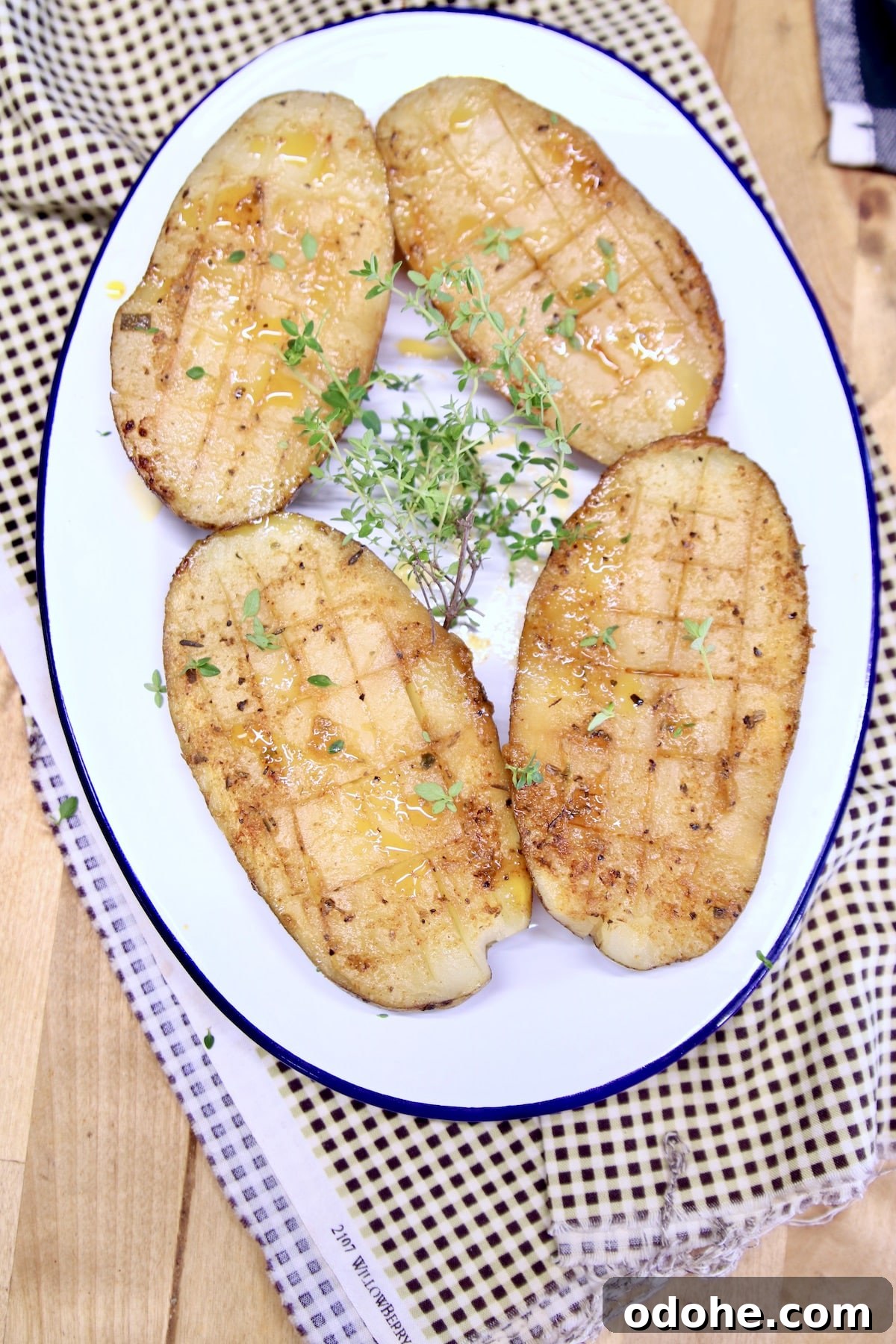Grilled potatoes on a platter.