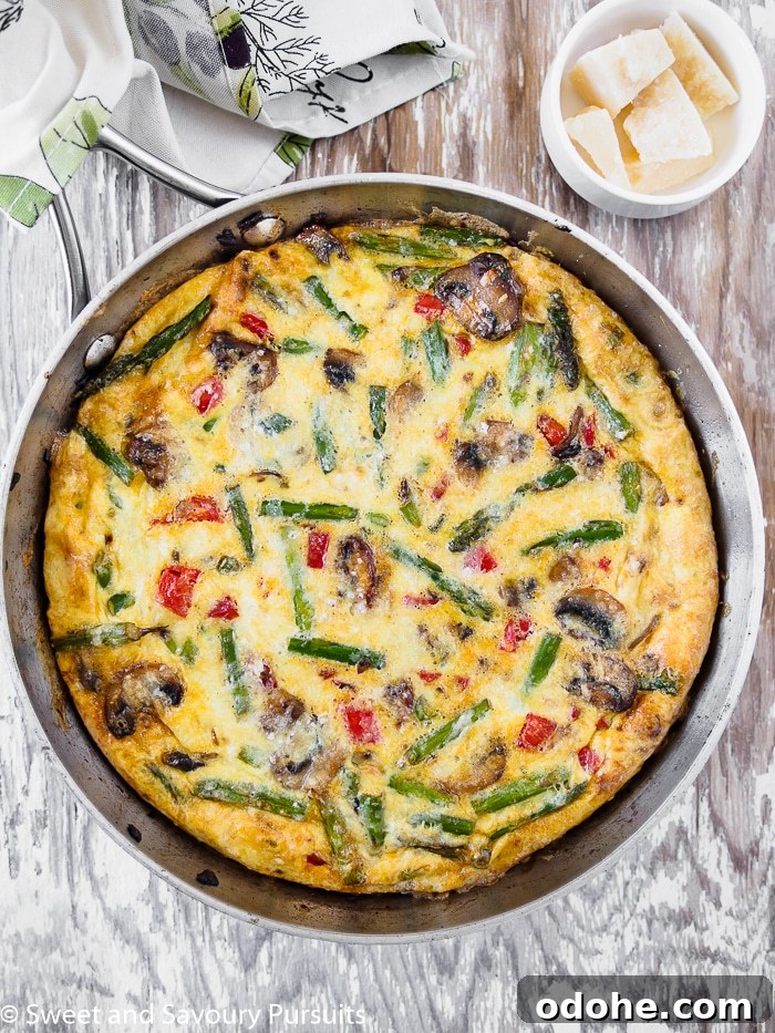 Vegetable Frittata Recipe with Fresh Herbs and Melted Cheese 2 A Healthy Vegetable Frittata in a skillet.