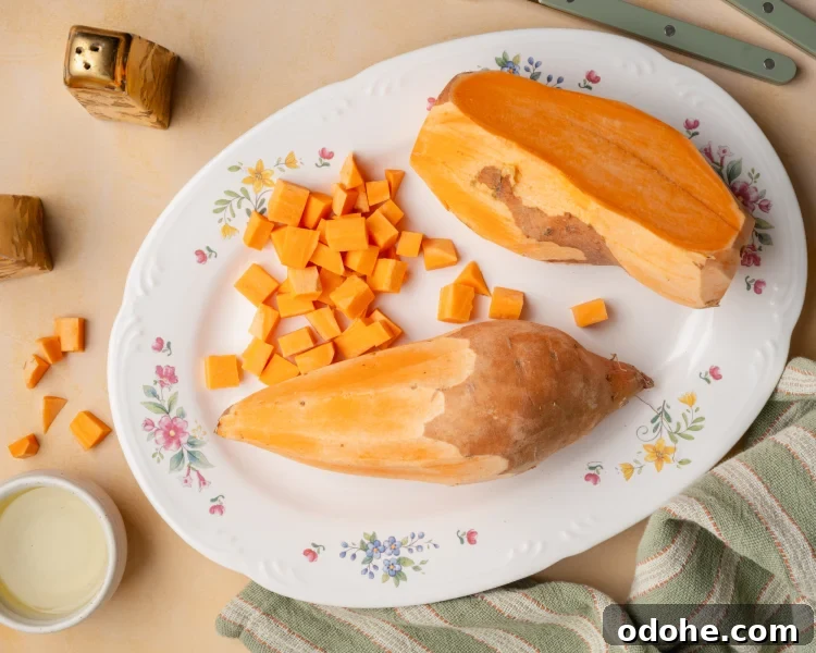 Peeling two big sweet potatoes and dicing them into small cubes.